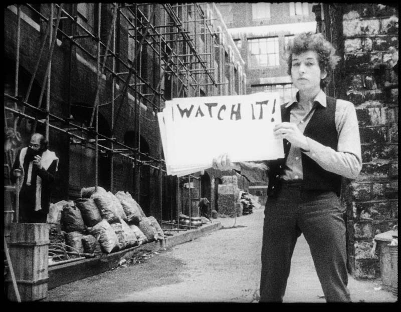 Bob Dylan holding sign in Subterranean Homesick Blues video