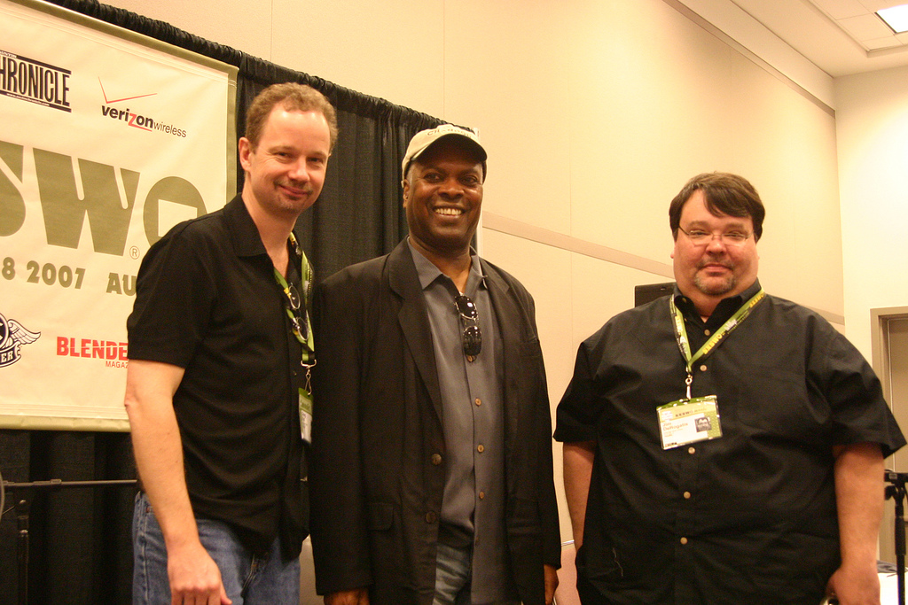 Greg Kot and Jim DeRogatis of Sound Opinions standing with Booker T.Jones